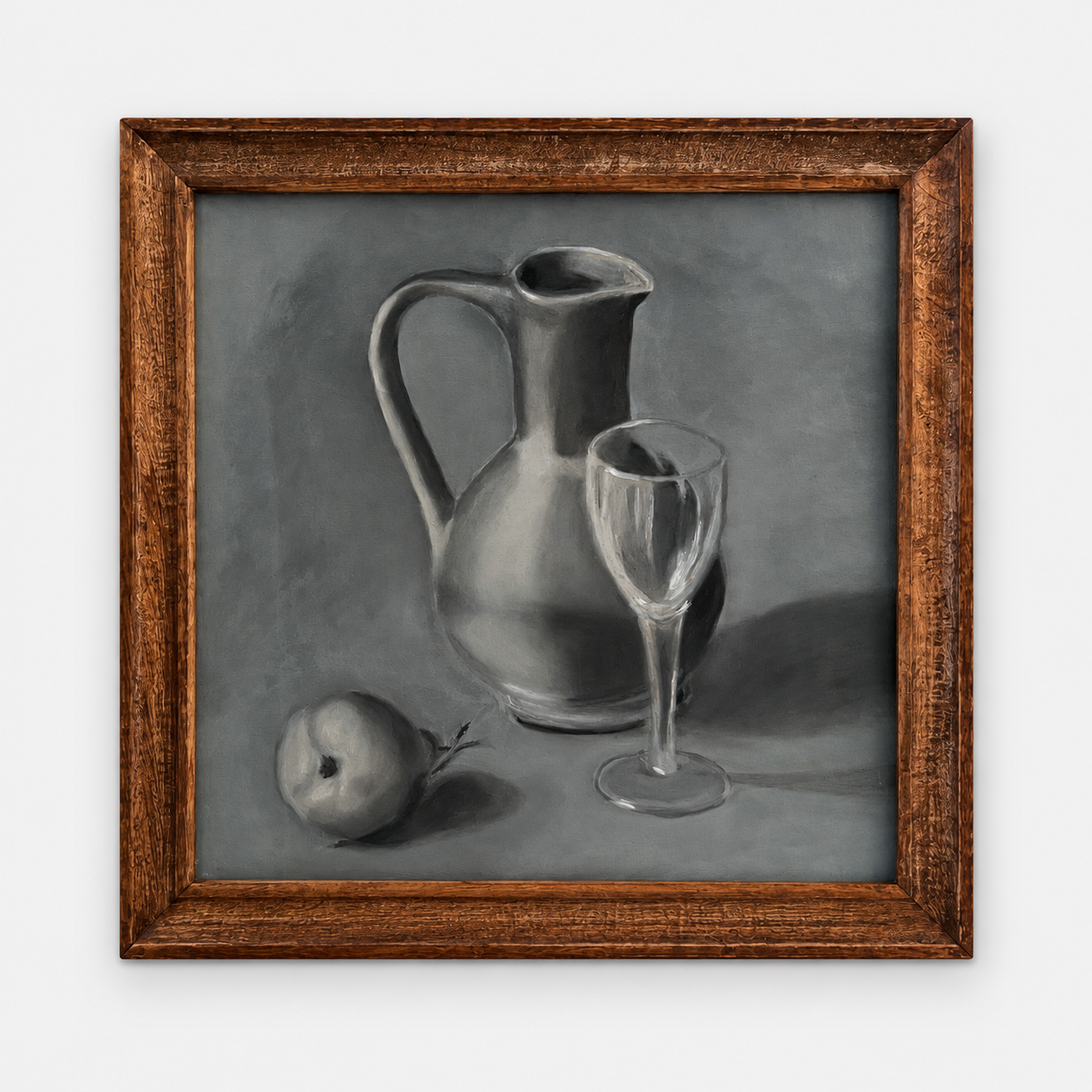 Charcoal still life with pitcher, wine glass and apple, framed and hung on a white wall