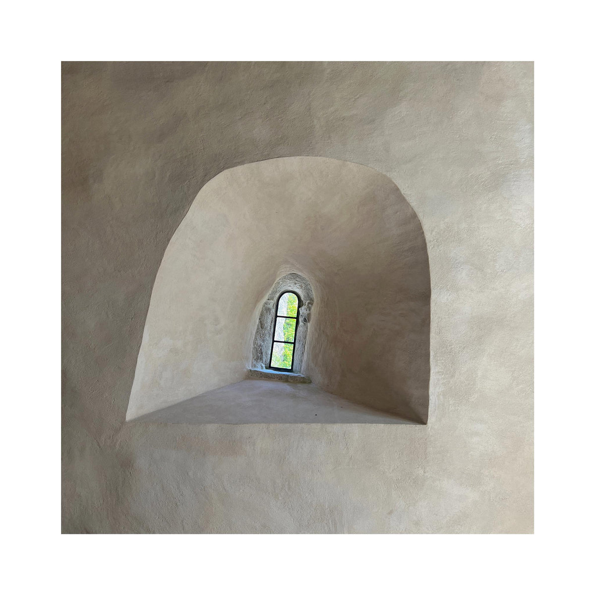 An interior architectural scene with a recessed arched alcove and a small arched window at the far end, showing a bright outdoor view. The image is presented as a centered square artwork or print on a white background.