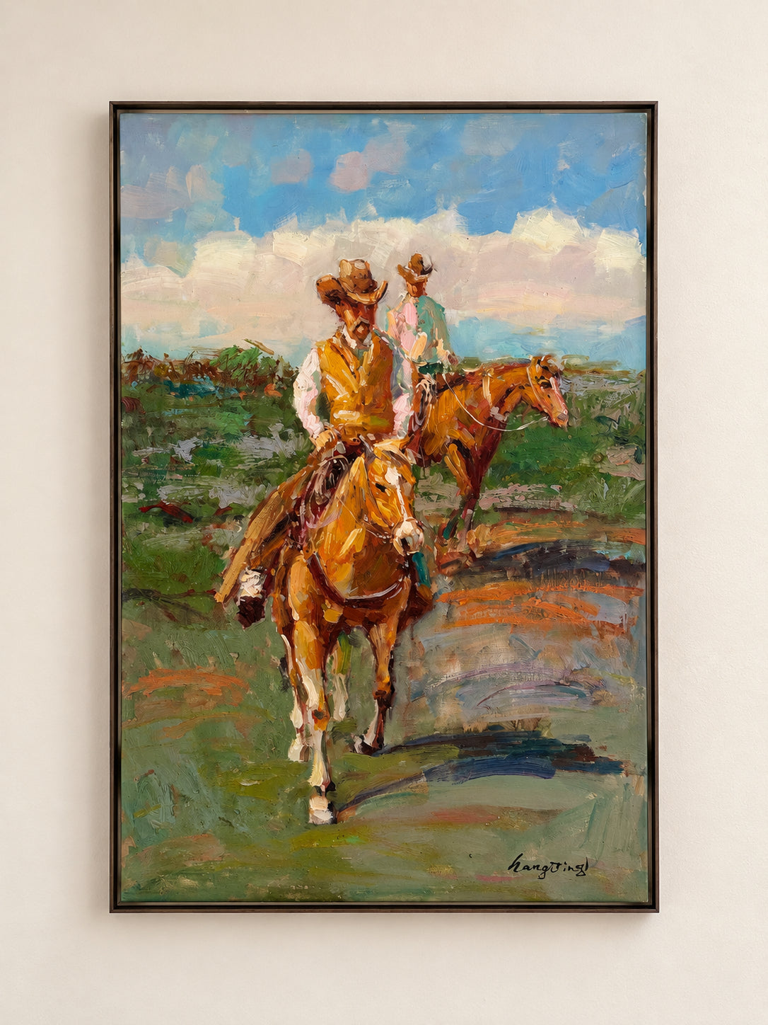 Vintage acrylic painting of two cowboys on horseback beneath an open sky, in a slim dark float frame
